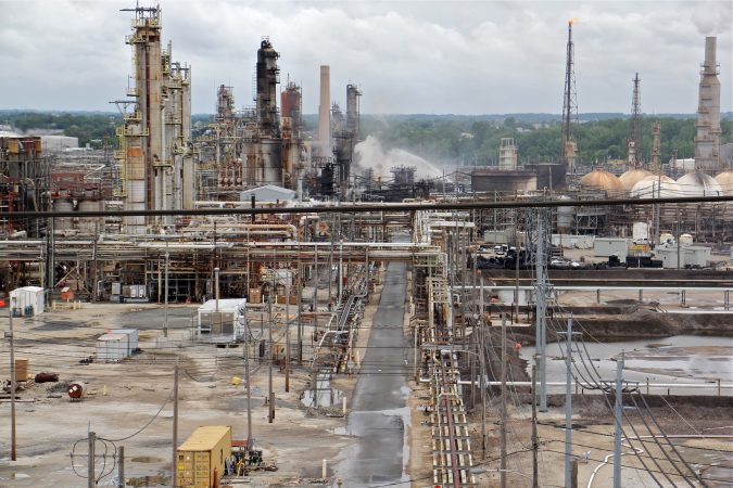 A fire burns at the Philadelphia Energy Solutions refinery hours after a series of early morning explosions at the 150-year-old industrial complex at 3100 W. Passyunk Ave. (Emma Lee/WHYY)