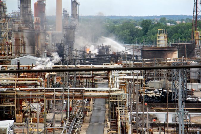 A fire burns at the Philadelphia Energy Solutions refinery hours after a series of early morning explosions at the 150-year-old industrial complex at 3100 W. Passyunk Ave. (Emma Lee/WHYY)
