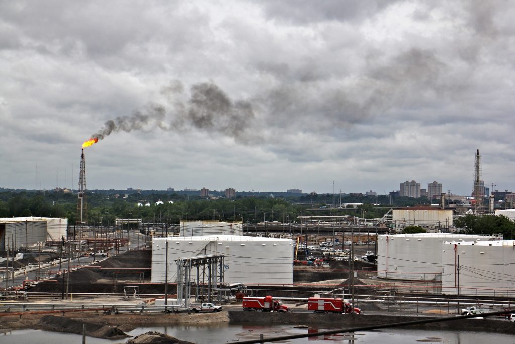 2019 06 21-e lee-philadelphia energy solutions refinery-explosion and fire A large flare burns off fuel at Philadelphia Energy Solutions refinery while firefighters battle a fire there. The wind carried the black smoke toward residential areas of South Philadelphia. (Emma lee/WHYY)