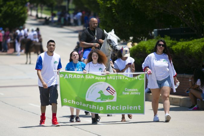 During the San Juan Bautista Parade, four high school students from Camden were awarded scholarships to continue their education in college. (Miguel Martinez/WHYY)