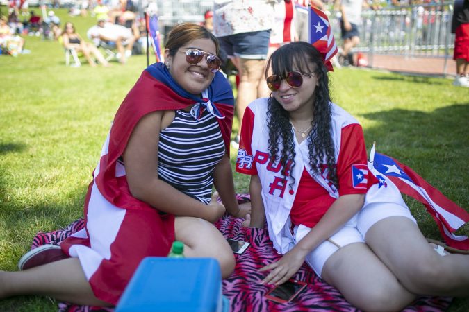 Ashley Garcia and Araceli Novoa participate in the San Juan Bautista Parade and Festival. The parade has been a tradition in the city for the past 62 years. (Miguel Martinez/WHYY)