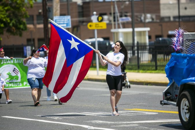 Thousands gather at the Camden’s waterfront to celebrate the San Juan Bautista Parade and Festival. The parade has been a tradition in the city for 62 years. (Miguel Martinez/WHYY)