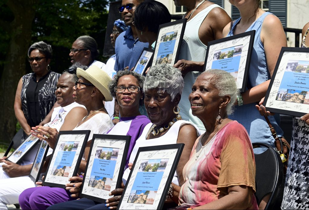 Community Champions Awarded at Unity Day in Germantown Award recipients pose for pictures after a ceremony at the inaugural Unity Day at Vernon Park, in Germantown, on Saturday. (Bastiaan Slabbers for WHYY)