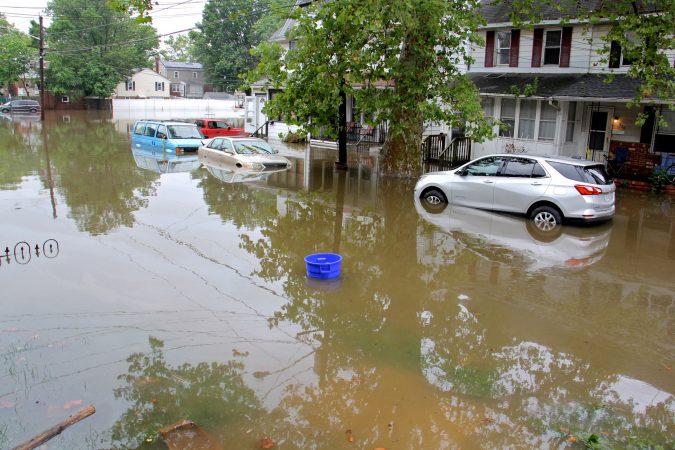 Cars, homes and streets were swamped by heavy rains overnight in Westville, N.J. (Emma Lee/WHYY)