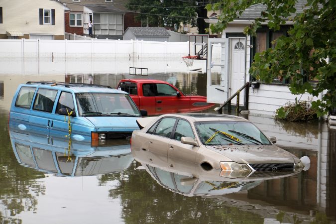 Cars, homes and streets were swamped by heavy rains overnight in Westville, N.J. (Emma Lee/WHYY)