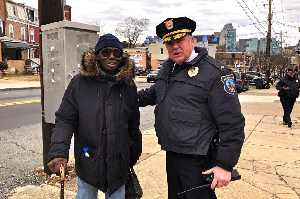2019-c barrish-robert tracy-wilmington-crime Wilmington Police Chief Robert J. Tracy with resident Robert Flonnory on Market Street. Tracy has been credited with bringing down the crime rate in the city by building bridges within communities. (Cris Barrish/WHYY)