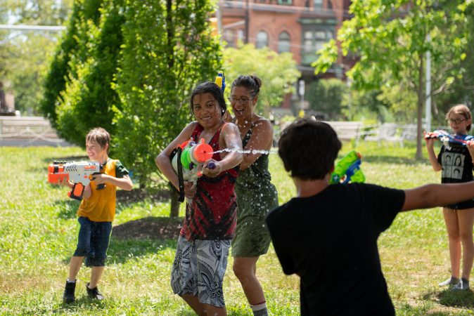 Families from across Philadelphia came to Fairmount Park to participate in the Water Fight Philly event on Sunday, June 30, 2019. (Kriston Jae Bethel for WHYY)