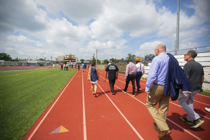 A group tours the Camden High School athletic facilities on Thursday, June 6, 2019 (Miguel Martinez for WHYY)