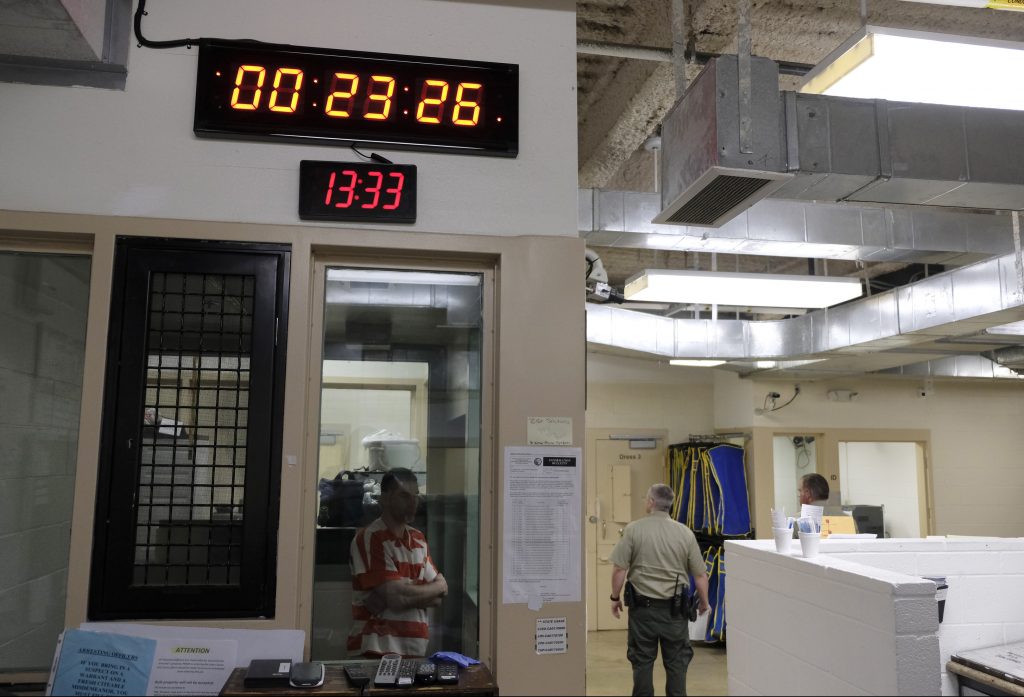 Death Behind Bars Q And A A clock at top counts down intervals between checks on inmates in the booking area holding cells at the Lake County Jail in Lakeport, Calif., on Tuesday, April 16, 2019. Major reforms were put in place at the jail following the 2015 suicide of a woman with a history of mental health problems who had repeatedly begged for help. Her son’s lawsuit resulted in $2 million wrongful death settlement. (AP Photo/Eric Risberg)