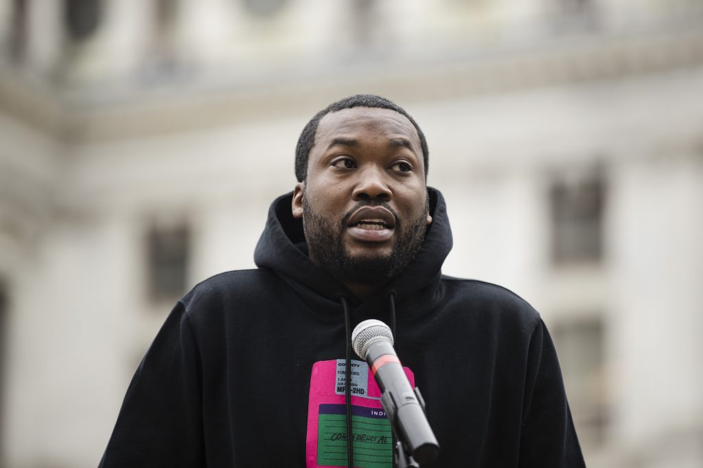 Meek Mill In this April 2, 2019, file photo, rapper Meek Mill speaks at a gathering in Philadelphia to push for drastic changes to Pennsylvania's probation system. On Monday, June 3 a Pennsylvania court granted Mill a July 16 hearing in the appeal of his 2008 conviction on gun and drug charges. (Matt Rourke/AP Photo)