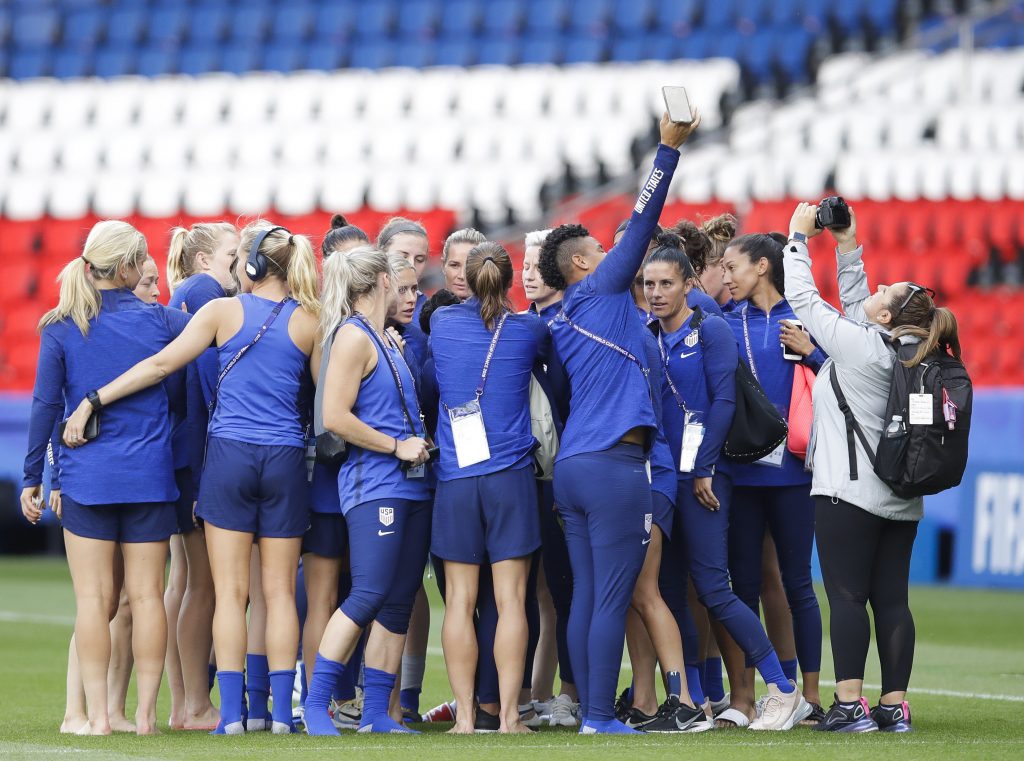 France United States Chile WWCup Soccer United States' players take photos during a visit at the Parc des Princes stadium a day before the Group F soccer match between United States and Chile at the Women's World Cup in Paris, Saturday, June 15, 2019. (AP Photo/Alessandra Tarantino)