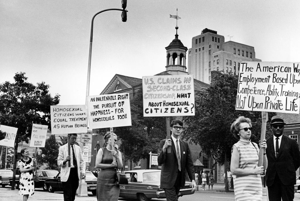 Stonewall at 50 FILE - In this July 4, 1967 file photo Kay Tobin Lahusen, right, and other demonstrators carry signs calling for protection of homosexuals from discrimination as they march in a picket line in front of Independence Hall in Philadelphia. In 2019, same-sex marriage is the law of the land in the U.S. and at least 25 other countries. LGBT Americans serve as governors, big-city mayors and members of Congress, and one _ Pete Buttigieg _ is waging a spirited campaign for president. (AP Photo/John F. Urwiller)