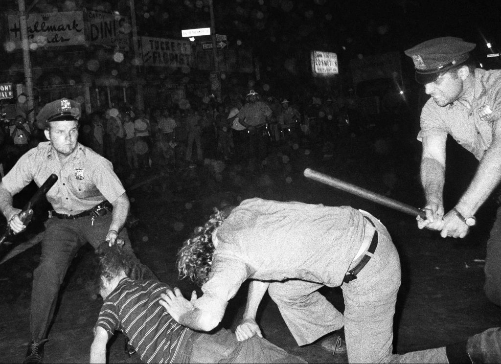 Stonewall at 50 FILE - In this Aug. 31, 1970 file photo, an NYPD officer grabs a youth by the hair as another officer clubs a young man during a confrontation in Greenwich Village after a Gay Power march in New York. A year earlier, the June 1969 uprising by young gays, lesbians and transgender people in New York City, clashing with police near a bar called the Stonewall Inn, was a vital catalyst in expanding LGBT activism nationwide and abroad. (AP Photo/File)
