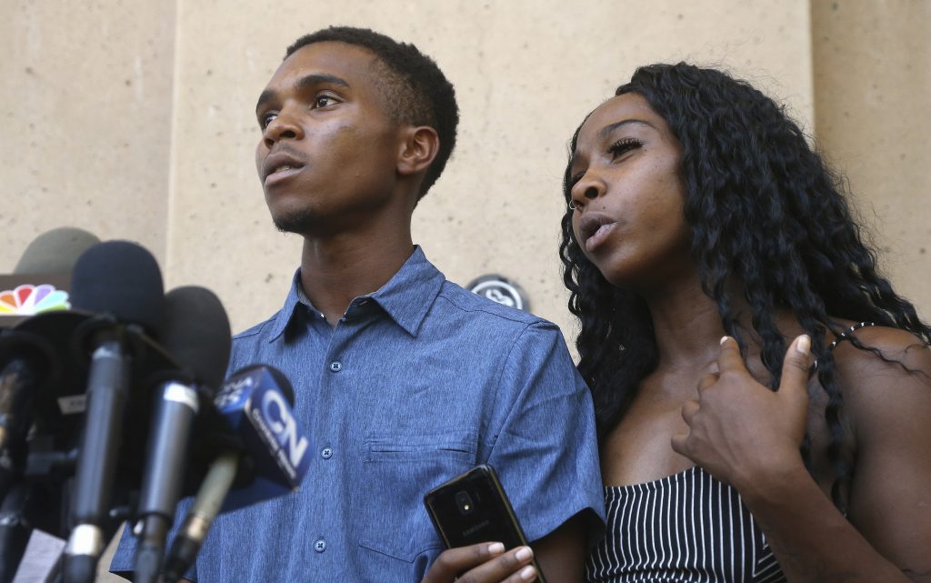 Shoplifting Civil Rights Claim Iesha Harper, (right), answers a question during a news conference as she is joined by her fiancee Dravon Ames, (left), at Phoenix City Hall, Monday, June 17, 2019, in Phoenix. Ames and his pregnant fiancée, Harper, who had guns aimed at them by Phoenix police during a response to a shoplifting report, say they don't accept the apologies of the city's police chief and mayor and want the officers involved to be fired. (Ross D. Franklin/AP Photo)
