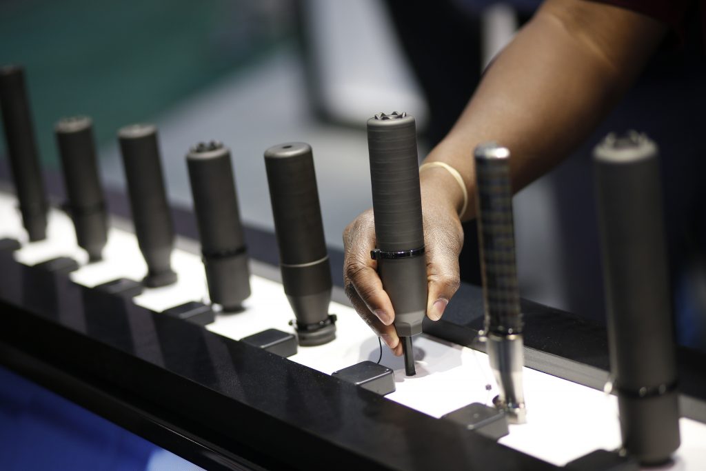 Gun Silencer Ban In this Jan. 19, 2016 file photo, gun silencers are on display at the Sig Sauer booth at the Shooting, Hunting and Outdoor Trade Show in Las Vegas. Gun silencers like the one used in a recent lethal shooting in Virginia Beach would be banned under legislation that U.S. Sen. Bob Menendez of New Jersey introduced Friday, June 21, 2019. (John Locher/AP Photo, File)