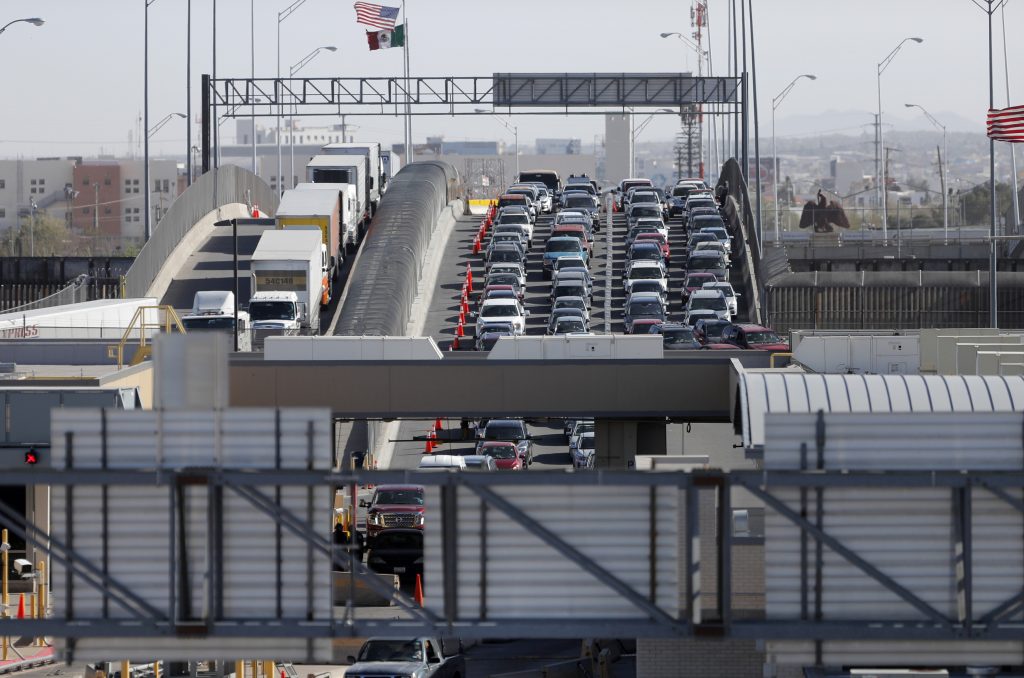 Texas-Border Deaths FILE - In this March 29, 2019, file photo, cars and trucks line up to enter the U.S. from Mexico at a border crossing in El Paso, Texas. Authorities in far South Texas say U.S. Border Patrol agents have discovered the bodies of four people, including three children, who appeared to have died from heat exposure after crossing the Rio Grande. Hidalgo County sheriff's Sgt. Frank Medrano said the bodies of a woman in her early 20s, a toddler and two infants were found Sunday, June, 23, 2019, in or near Anzalduas Park, which borders the river in the city of Mission. (AP Photo/Gerald Herbert, File)