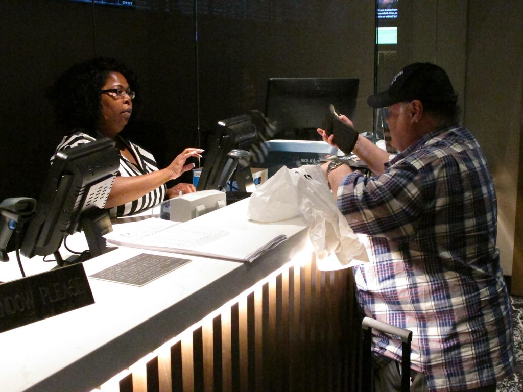 Sports Betting In this June 27, 2019 photo, a clerk takes a bet from a gambler at the new sportsbook at Bally's casino in Atlantic City, N.J. New Jersey surpassed Nevada in terms of sports betting volume in May, taking the national lead for the first time. (AP Photo/Wayne Parry)