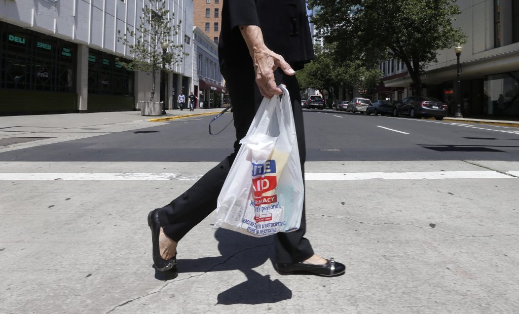 California Plastic Bags A woman walks with a plastic bag