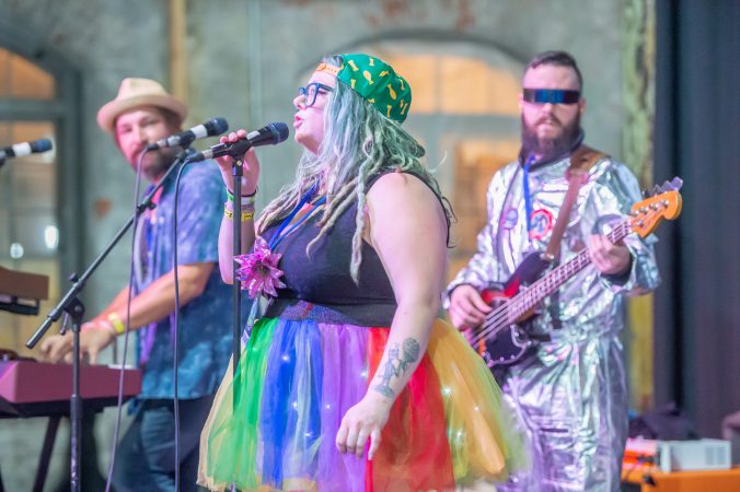Liz Cisco who fronts the Trenton-based band MegaNow performs for an audience. (Jonathan Wilson for WHYY)