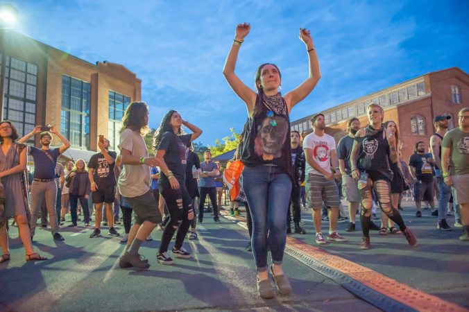 Fans of the Trenton-based band Molly Rhythm enjoy their Saturday evening performance. (Jonathan Wilson for WHYY)