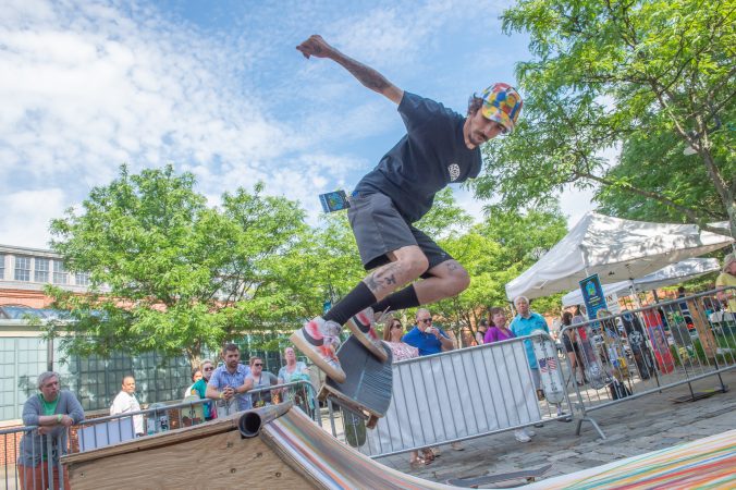 Rich Whitehead takes his turn on a ramp set up by Freedom NJ, a non-profit that creates pop-up skateboard parks for kids in New Jersey and the surrounding states. (Jonathan Wilson for WHYY)
