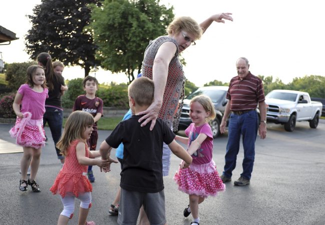 Linda Rutherford (center) helps direct her grandchildren as members of the Miller Family practice their hoedown routine June 7, 2018, at the home of Lester Miller in Kutztown, Pennsylvania. (Matt Smith for WHYY)