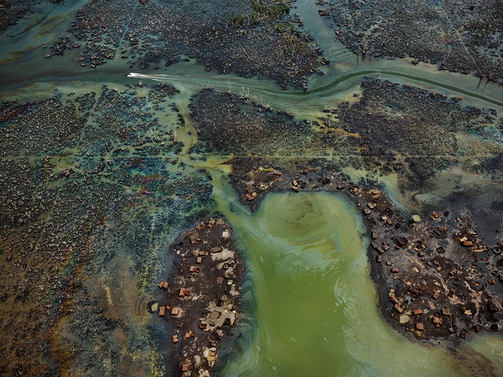 In Nigeria’s oil-rich Niger Delta, oil bunkering — the practice of siphoning oil from pipelines — has transformed parts of the once-thriving delta ecosystem into an ecological dead zone, according to the U.N. Environment Programme. In Nigeria's oil-rich Niger Delta, oil bunkering — the practice of siphoning oil from pipelines — has transformed parts of the once-thriving delta ecosystem into an ecological dead zone, according to the U.N. Environment Programme.
(Edward Burtynsky, courtesy Robert Koch Gallery, San Francisco / Nicholas Metivier Gallery, Toronto)
