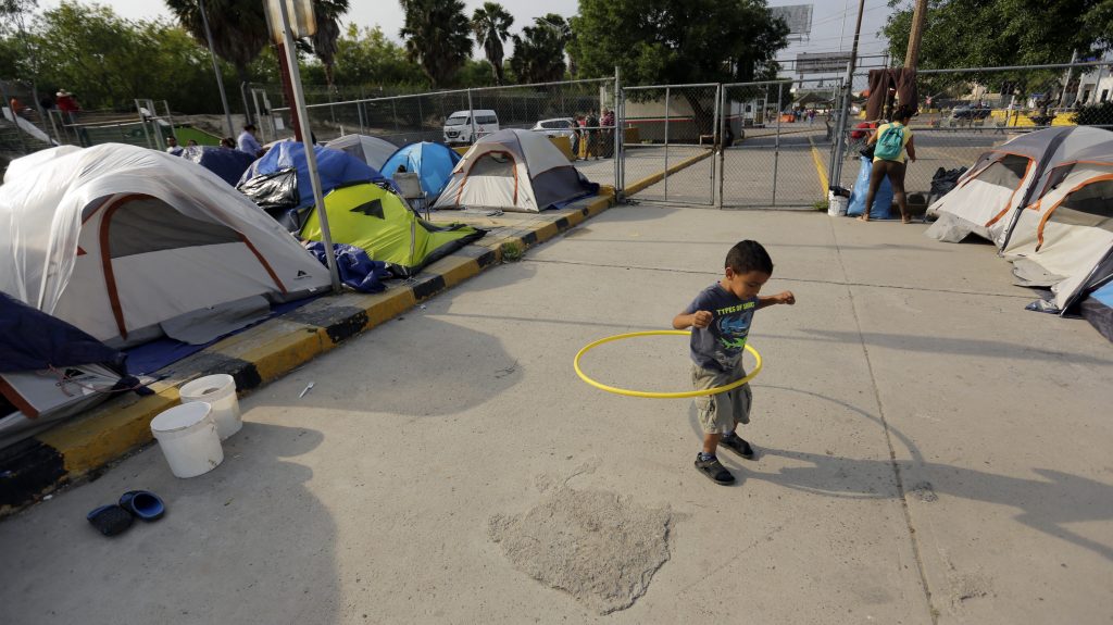 William Linares, a 5-year-old from Honduras, plays in an encampment where he is living near the international bridge in Matamoros, Mexico, on April 30. The boy is traveling with his mother, Suanny Gomez, and seeking asylum in the United States. William Linares, a 5-year-old from Honduras, plays in an encampment where he is living near the international bridge in Matamoros, Mexico, on April 30. The boy is traveling with his mother, Suanny Gomez, and seeking asylum in the United States. (Eric Gay/AP Photo)