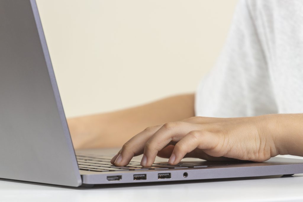 Kid Hands Typing On Laptop Computer Keyboard (Bigstock/Veja)