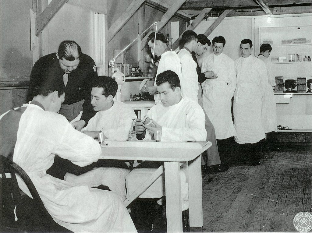 blacky with Dental Corps Capt. Charles W. Felt (in black tunic in background) training members of the U.S. Army Dental Corps at the 186th General Hospital, Fairford, UK. (Courtesy U.S. Army, National Archives, Washington, DC.)
