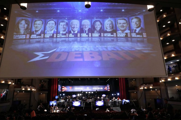 A monitor displays the Democratic presidential candidates that will appear during the second night of the Democratic primary debate hosted by NBC News at the Adrienne Arsht Center for the Performing Arts, Wednesday, June 26, 2019, in Miami. (AP Photo/Brynn Anderson)