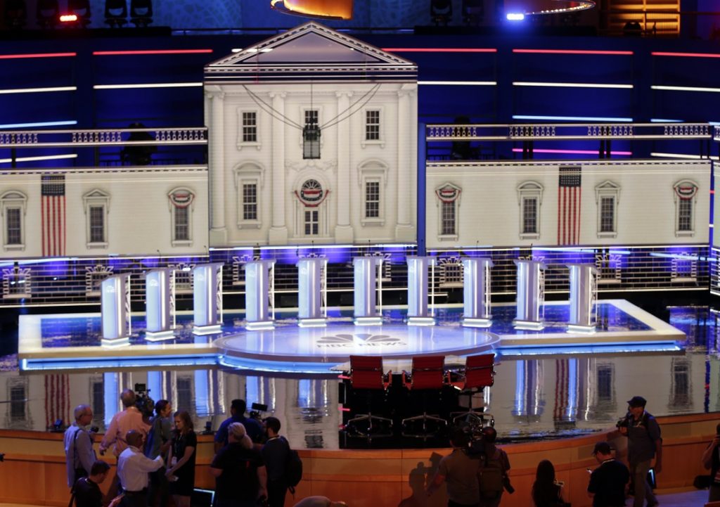Debate Members of the media gather for a walk-through of the stage set-up for the first democratic debate, Wednesday, June 26, 2019. Ten presidential candidates, led by Sen. Elizabeth Warren, are set to converge on the debate stage on the first night of Democratic debates to offer their pitches to the American people and attempt a breakout moment for their campaigns. (Marta Lavandier/AP Photo)