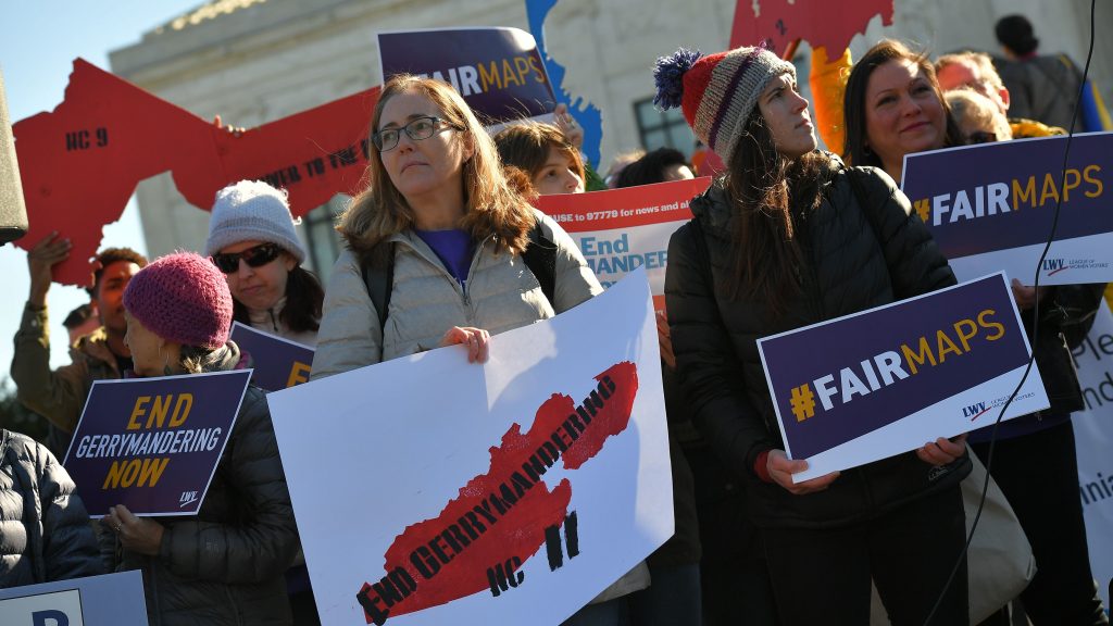 People gather during a rally to coincide with the Supreme Court hearings on the redistricting cases in Maryland and North Carolina in front of the Supreme Court on March 26. (Mandel Ngan/AFP/Getty Images)
