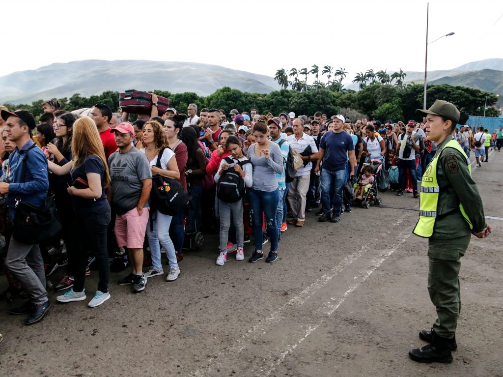 People line up to cross the Simon Bolivar international bridge from San Antonio del Tachira in Venezuela to Cucuta, in Colombia, to buy goods due to supplies shortage in their country. Venezuela’s President Nicolás Maduro ordered the reopening of the country’s border with Colombia on Friday. People line up to cross the Simon Bolivar international bridge from San Antonio del Tachira in Venezuela to Cucuta, in Colombia, to buy goods due to supplies shortage in their country. Venezuela's President Nicolás Maduro ordered the reopening of the country's border with Colombia on Friday. (SCHNEYDER MENDOZA/AFP/Getty Images)