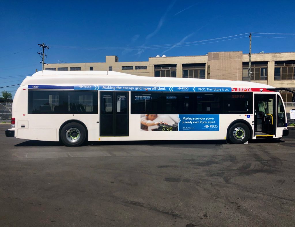 one-of-septa-s-new-electric-buses-darryl-murphy.original A SEPTA bus is parked in a parking lot, with a blue sky overhead.