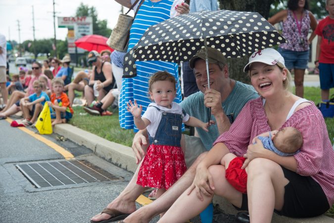 The O'Brien family from Media decided to come to the Marple Newtown Fourth of July parade specifically because of the quiet zone. With two young kids in tow, including a newborn, parents Jessica and Matt appreciated the inclusion of a quiet zone. (Emily Cohen for WHYY)