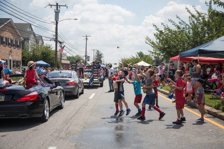Kids vie for candy that’s thrown by parade marchers at the annual Marple Newtown Fourth of July Parade. (Emily Cohen for WHYY)