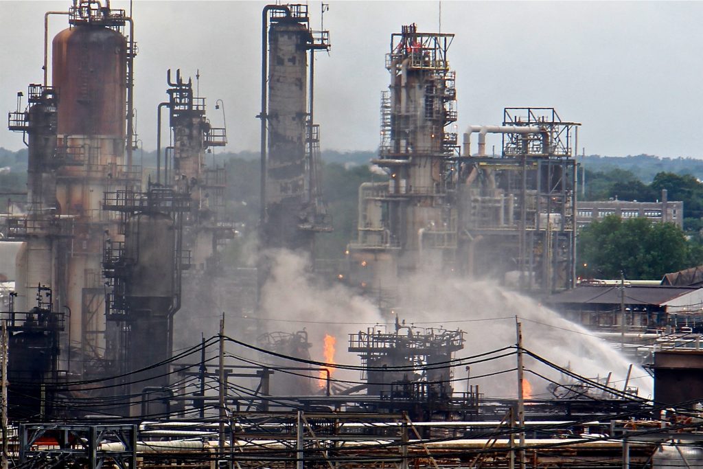 A fire burns at the Philadelphia Energy Solutions refinery hours after a series of early morning explosions on June 21, 2019. (Emma Lee/WHYY)