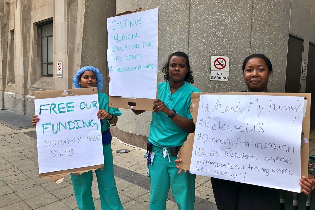 2019 07 03-n feldman-hahnemann hospital-residents Anesthesiology residents Archana Gundigi, Rosemary De La Cruz, and Jo Linnen protest outside Hahnemann, demanding that management release their government funding to enable them to seek placements elsewhere. (Nina Feldman/WHYY)