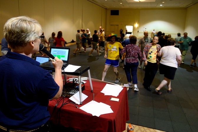 Marilyn 'Zip' Warmerdam calls a 'tip' at a Center City hotel ballroom during the 36th annual LGBT Square Dance Convention.
