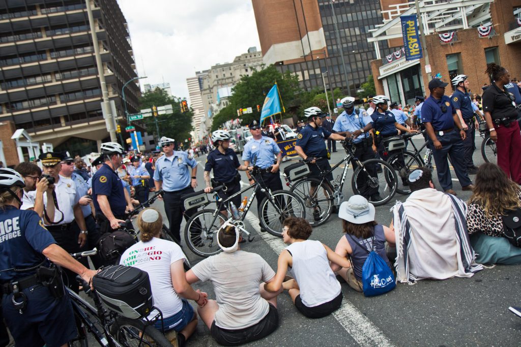 Protesters found a way around the police barricade and blocked Philadelphia’s Fourth of July Parade. (Kimberly Paynter/WHYY)