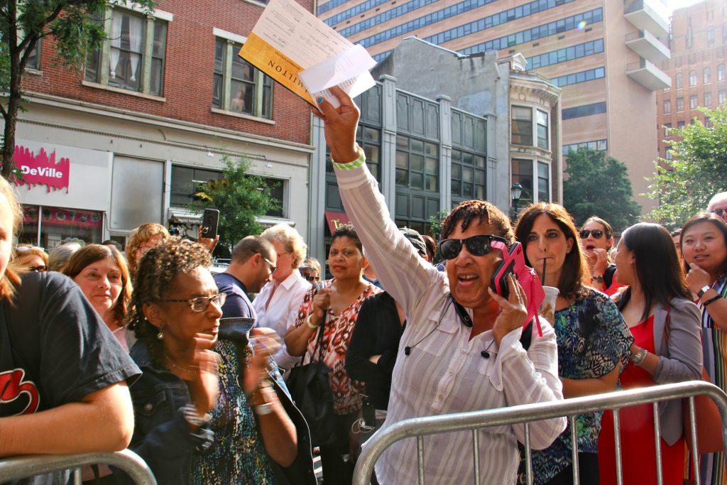 2019 07 09-e lee-philadelphia forrest theatre-hamilton ticket line Carolyn Brooks Rice cheers when her green and white wristband gets a favorable time slot in the rush to buy tickets to see