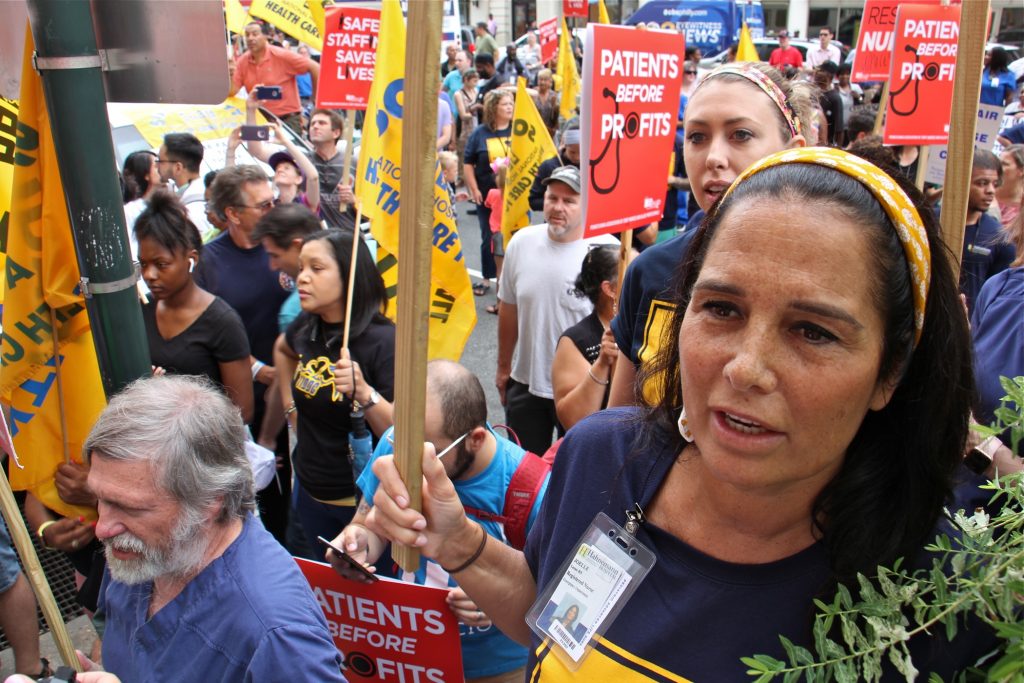 2019 07 11-e lee-philadelphia hahnemann hospital-rally Hahnemann nurse Joelle Leone (right) chants with about 800 protesters outside Hahnemann Hospital to demand that the facility remain open. (Emma Lee/WHYY)