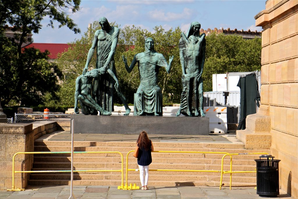 2019 07 12-e lee-philadelphia museum of art-social consciousness A museum patron pauses at the west entrance of the Philadelphia Museum of Art to look at