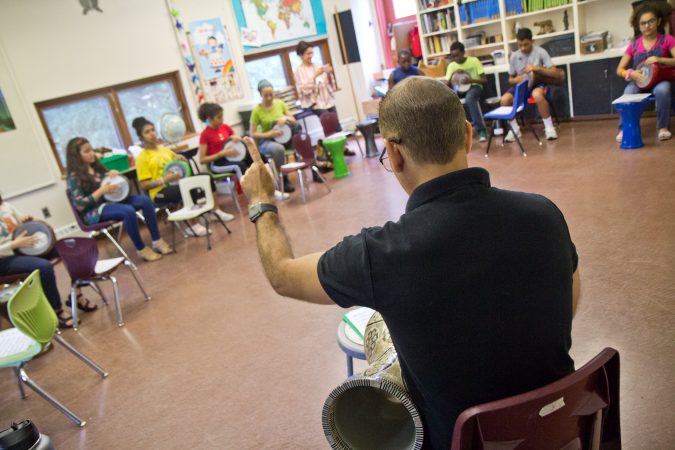 Campers learn Arabic rhythms at the Al-Bustan percussion camp. (Kimberly Paynter/WHYY)
