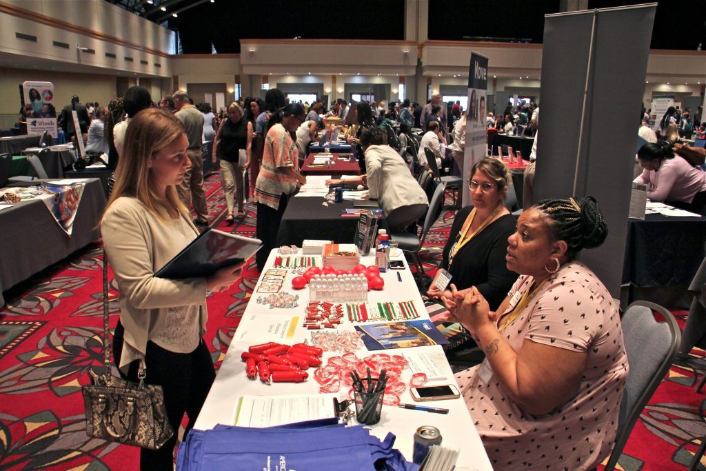 2019 07 25-e lee-philadelphia convention center-hahnemann job fair Stephanie Burton (right) of the Dialysis Center of Philadelphia, recruits nurses during the Hire Hahnemann career fair put on by Philadelphia Works at the Pennsylvania Convention Center. (Emma Lee/WHYY)