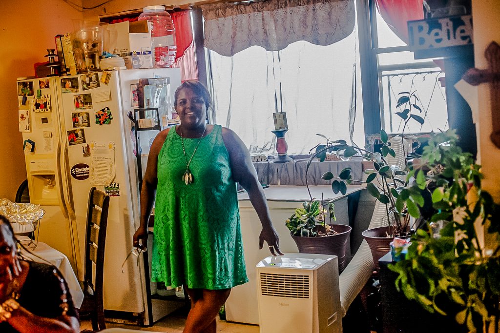 2019 7 18- b larrison- philadelphia- sheila armonstrong of 1050 north 10th street installed ac unit in PHA apartment to deal with summer heat -3 Sheila Armstrong stands in the living room of her 13th floor apartment at the Harrison Plaza buidling at 1050 North 10th Street where she installed an A/C unit to deal with the summer heat. (Brad Larrison for WHYY)