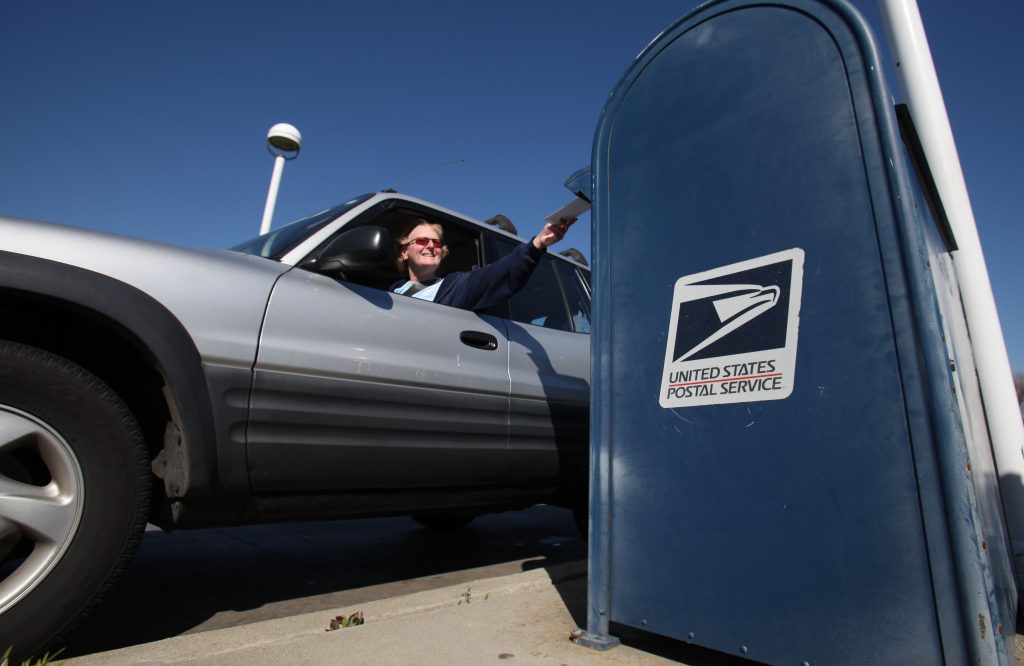 Postal Problems Voting In this photo taken Feb. 24, 2012, mail is deposited into an outdoor postal box (Rich Pedroncelli/AP Photo)