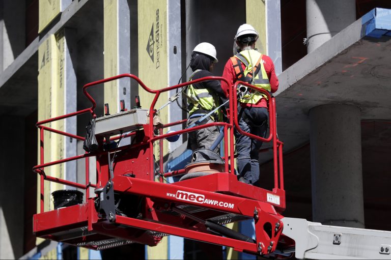 Workers labor at the construction site of a condominium building in the Newport section of Jersey City, N.J., Wednesday, May 2, 2018. (AP Photo/Julio Cortez)