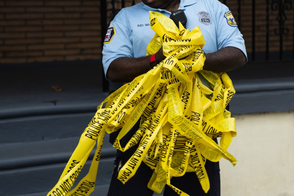 Shooting An officer removes crime scene tape after the investigation of what police say was a shooting with one victim in Philadelphia, Wednesday, June 19, 2019. (Matt Rourke/AP Photo)